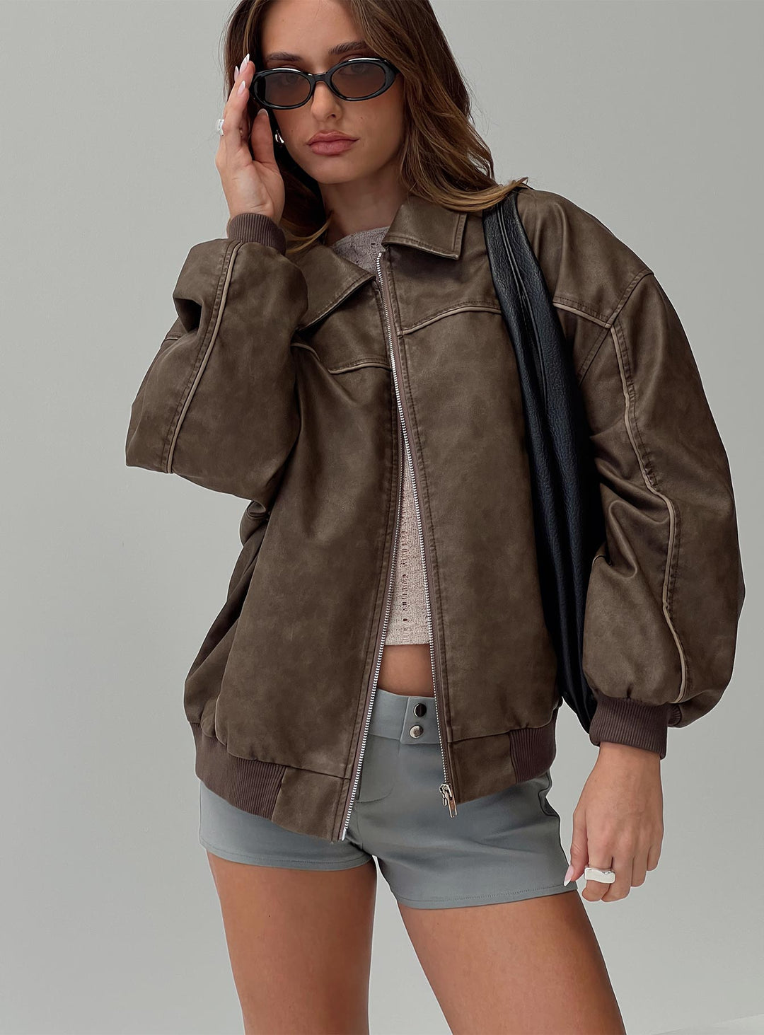Avria | Women’s dark washed faux leather zip bomber jacket