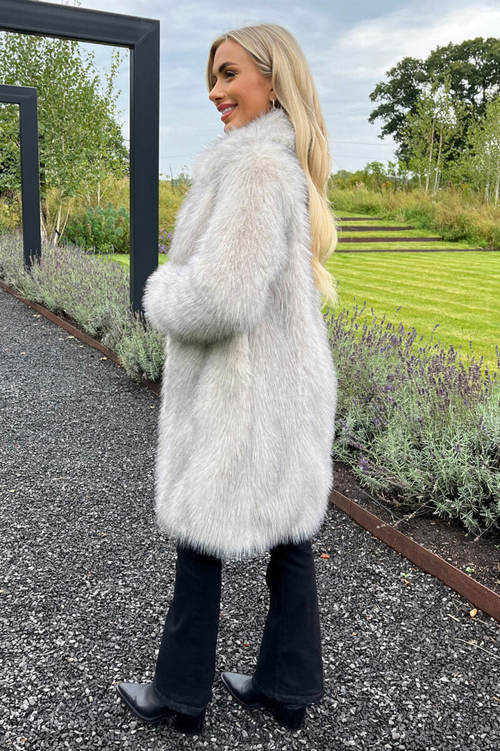 Arlita | Women’s long faux fur coat with collar and snap closure