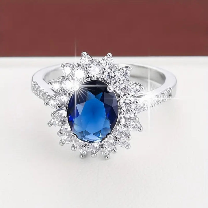 Bonnie | Women’s statement ring with sapphire blue stone and crystal halo design