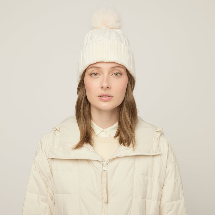 Halynn | Women’s cable knit beanie with a soft pom-pom accent