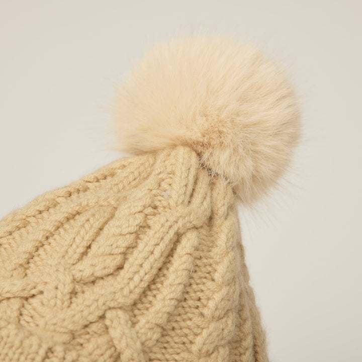 Lirena | Women’s textured cable knit pom beanie with a sculpted cold-season silhouette