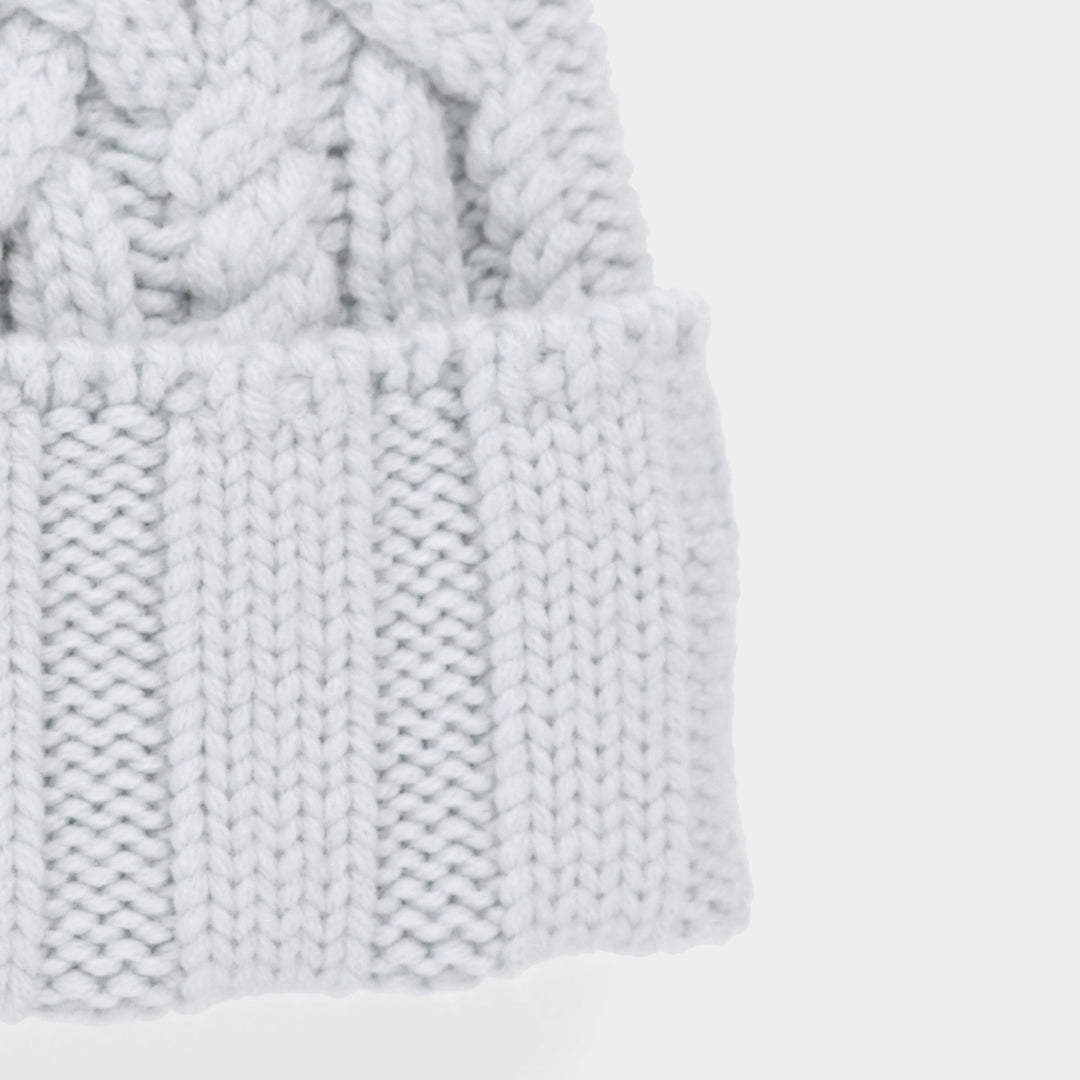 Halynn | Women’s cable knit beanie with a soft pom-pom accent