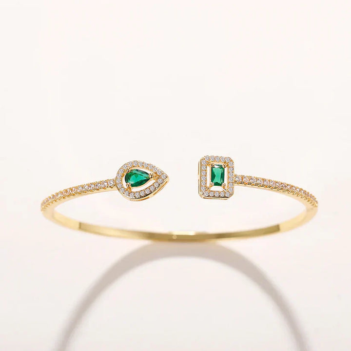 Heidi | Women’s open bangle bracelet with emerald stones and crystal accents