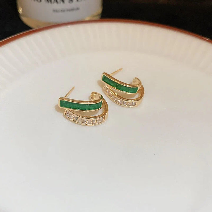 Fella | Women’s gold hoop earrings with green stone and crystal detail