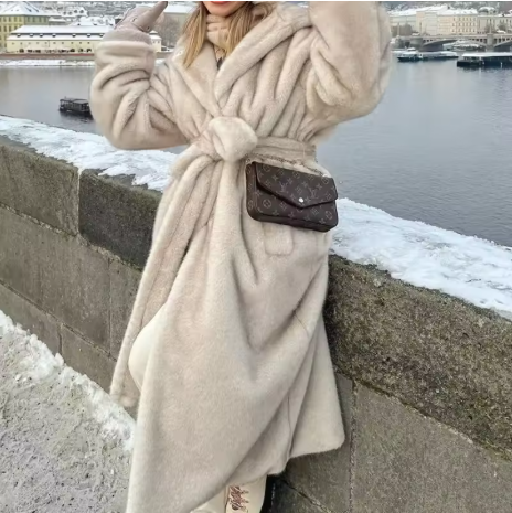 Zyrra | Women’s hooded faux fur long coat with a warm seasonal structure