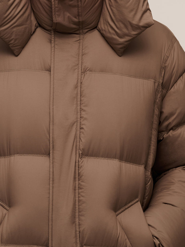 Corvyn | Women’s lightweight long winter coat with a sleek hooded silhouette