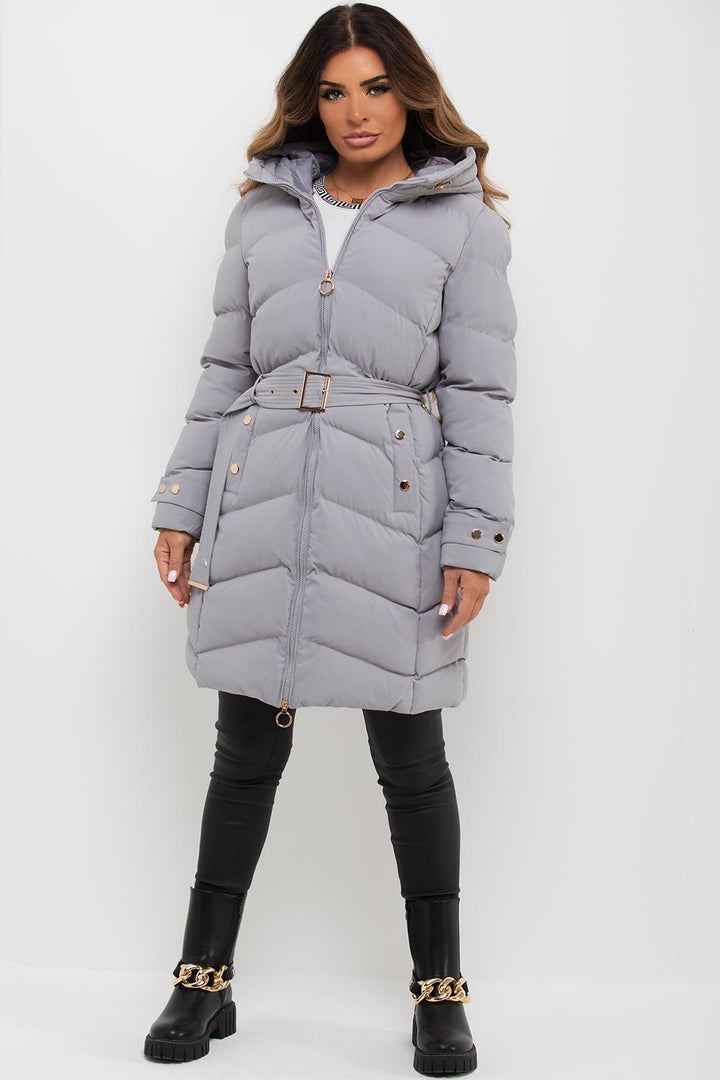Avelina | Women’s long puffer coat with belt and gold button detail