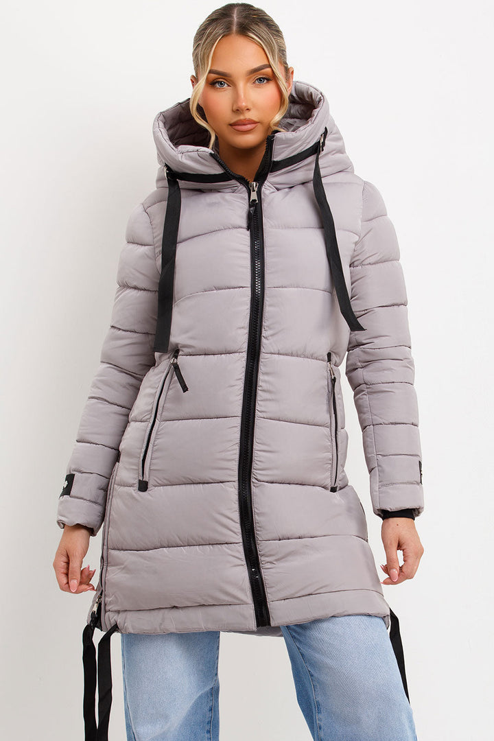 Ambriah | Women’s long puffer coat with hood and side straps