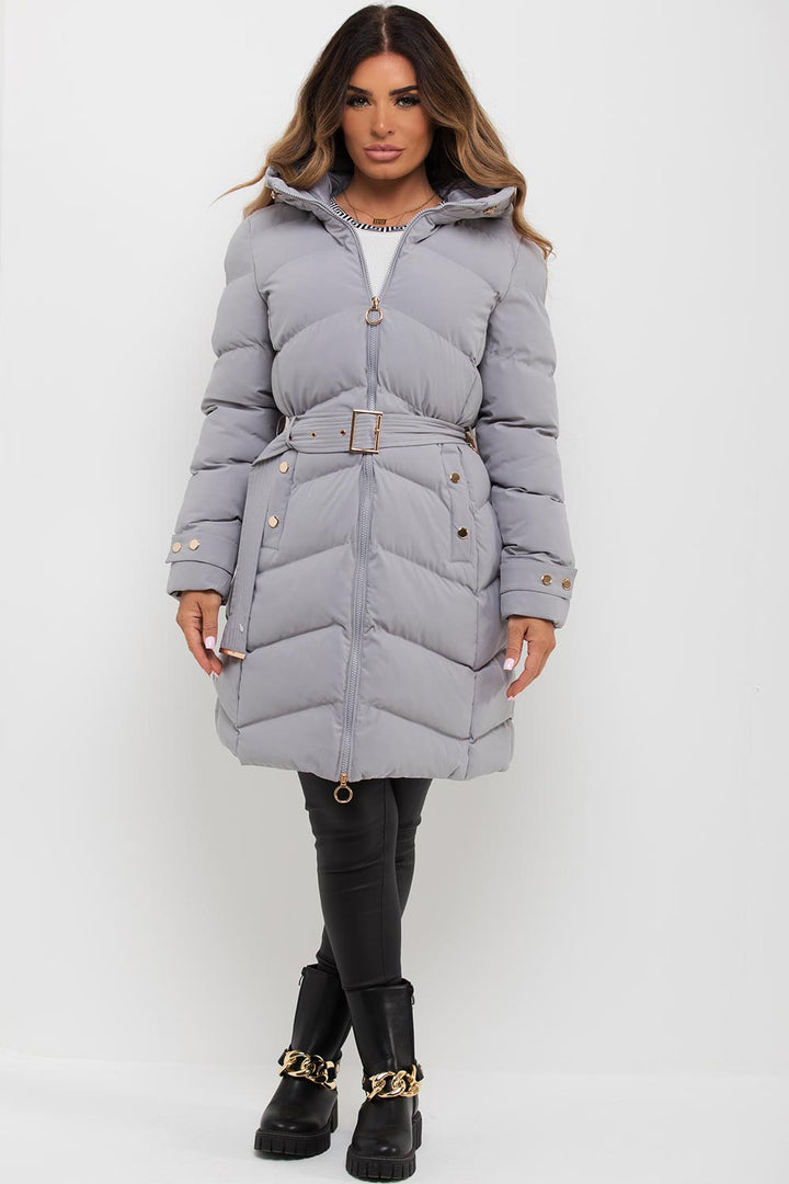 Avelina | Women’s long puffer coat with belt and gold button detail
